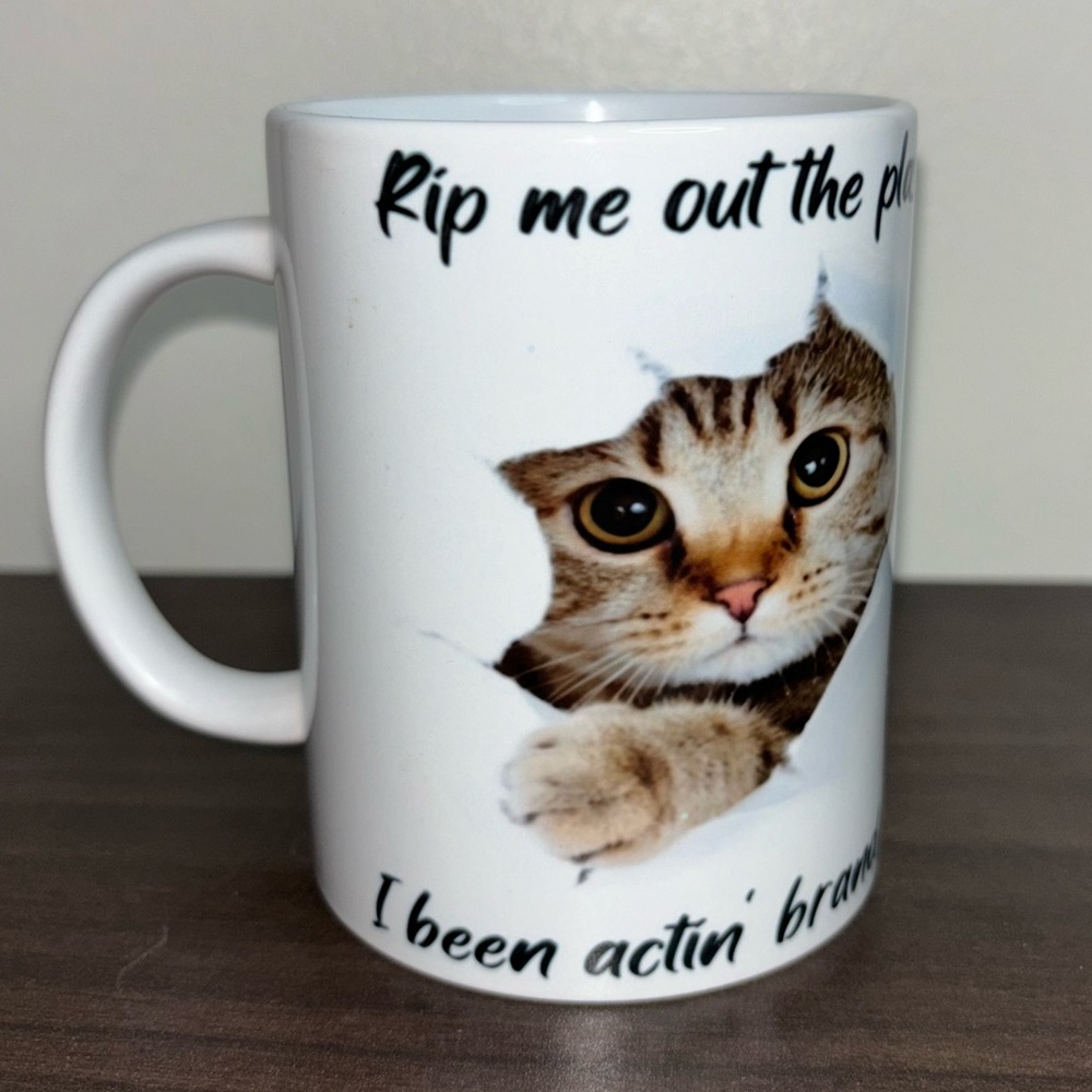 Funny Cat Mug Ripping Out of Paper by RuMi’s Shade LLC